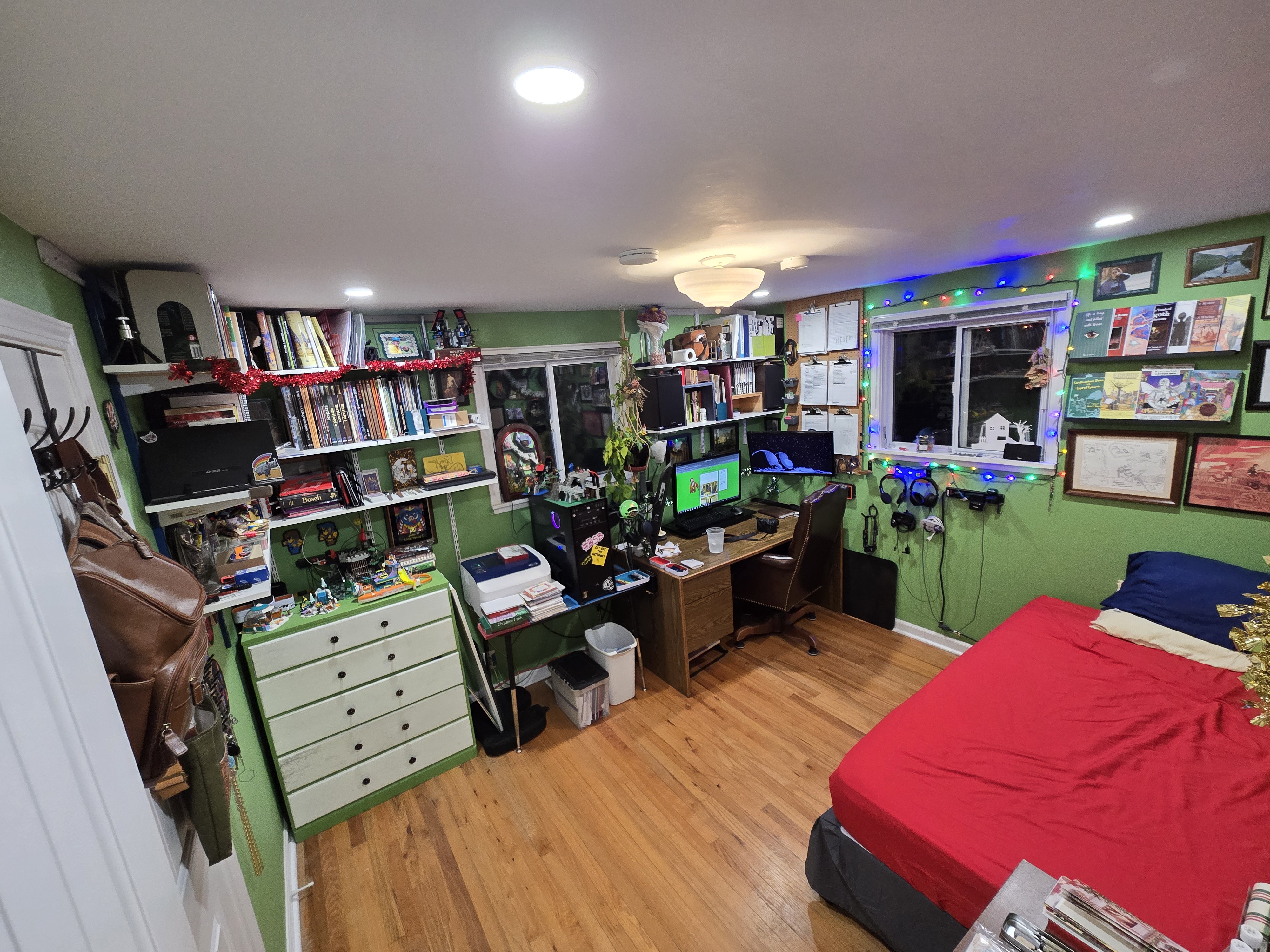 My office in 2024. Only one plant has survived from the previous year. There's a ton of lego everywhere, since I've turned to that for comfort a lot this year. I've also put up a shelf of all the various books I've managed to put out. 