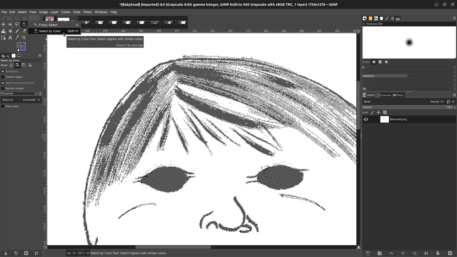 Gimp window in which the Babyhead monster illustration is open. In the toolbar the cursor is in the process of selecting the Select by Color tool.